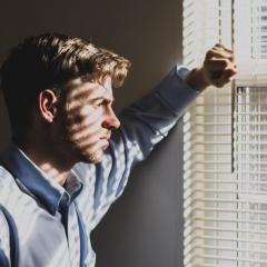 Man staring out window
