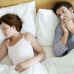 Couple in bed with cold